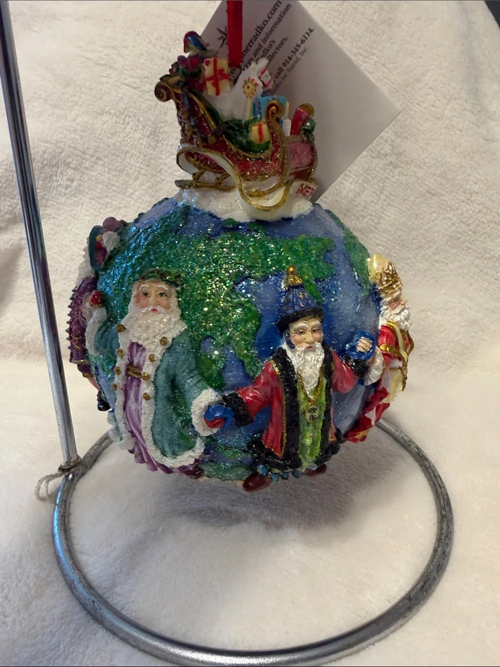 Christopher Radko Santa’s around the world with tag